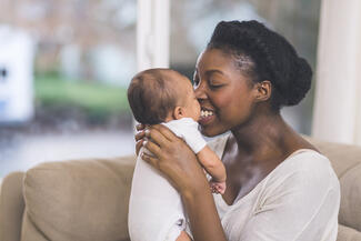 Mother holding infant nose to nose_S.jpg