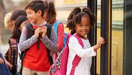 Kids getting on the bus.