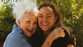 Senior woman and middle aged woman hugging