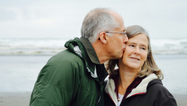 Man kissing his partner on the cheek