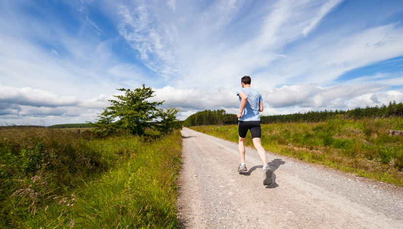 Man running on rail trail
