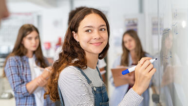 young teen at whiteboard